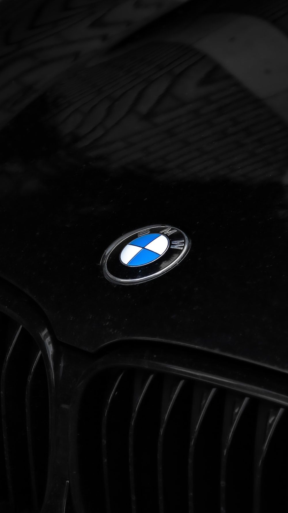  BMW Hintergrundbild 1000x1778. Foto zum Thema schwarzes BMW PKW Lenkrad