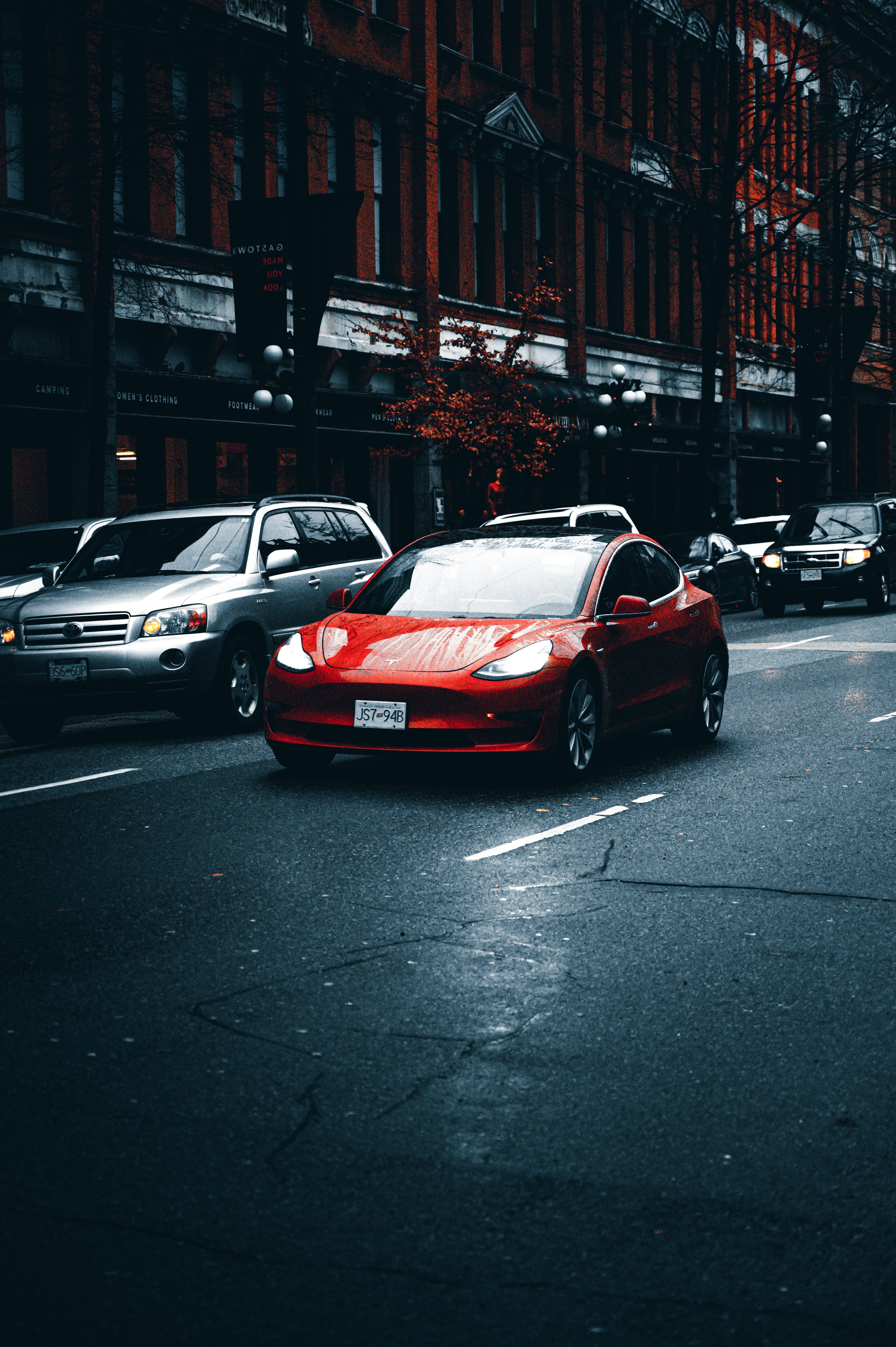 Tesla Hintergrundbild 3790x5696. A Red Tesla Car · Free