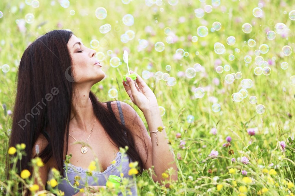  Blumenwiese Hintergrundbild 1200x799. Frau Bläst Seifenblasen Auf Blumenwiese Hintergrund Und Bild zum kostenlosen Download