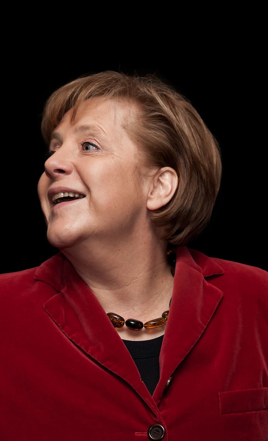  Angela Merkel Hintergrundbild 910x1499. HD Wallpaper: Woman In Red Button Up Top On Black Background, Angela Merkel