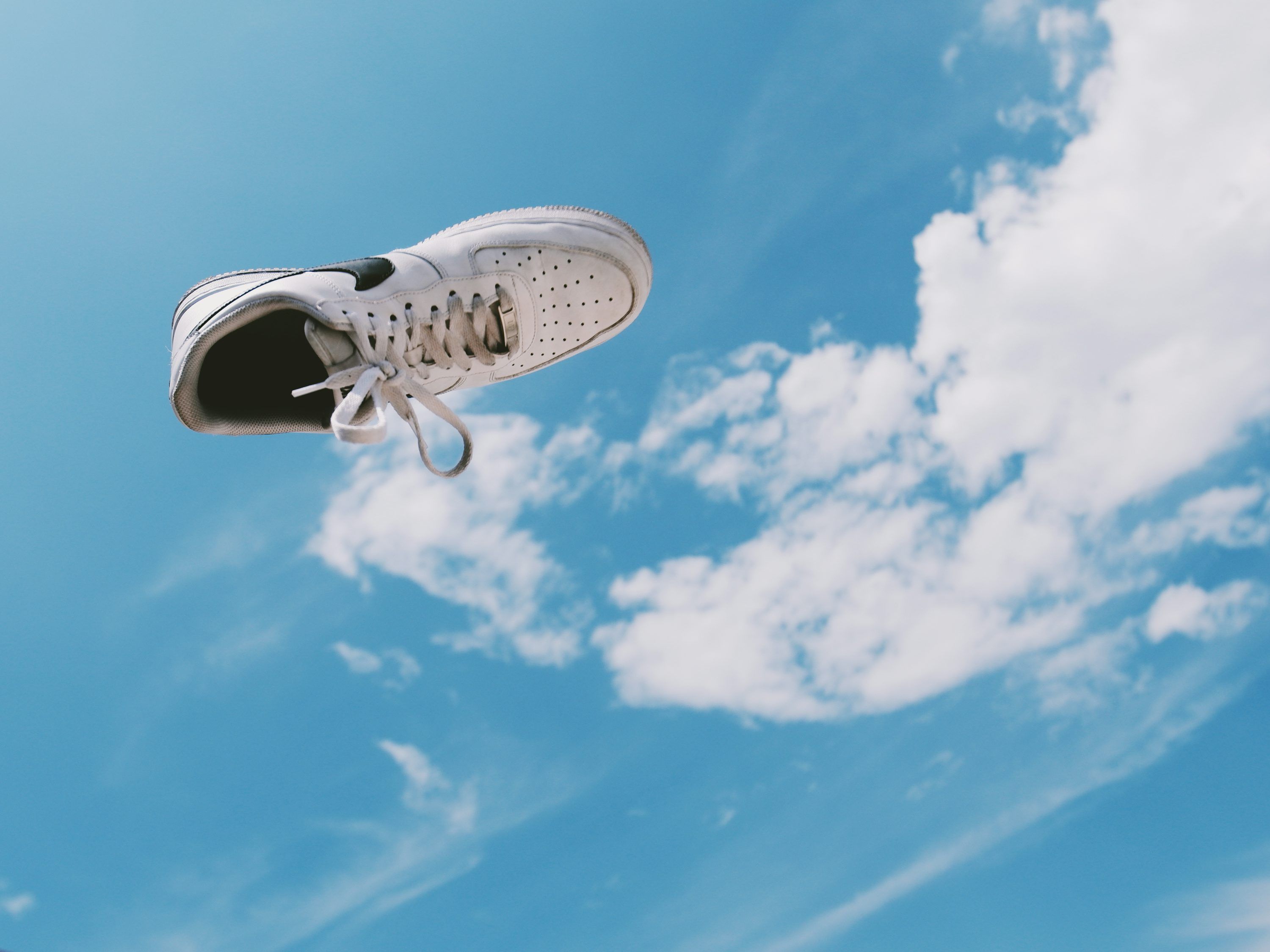  Nike Air Force Hintergrundbild 3000x2250. White and black nike sneakers under blue sky and white clouds photo